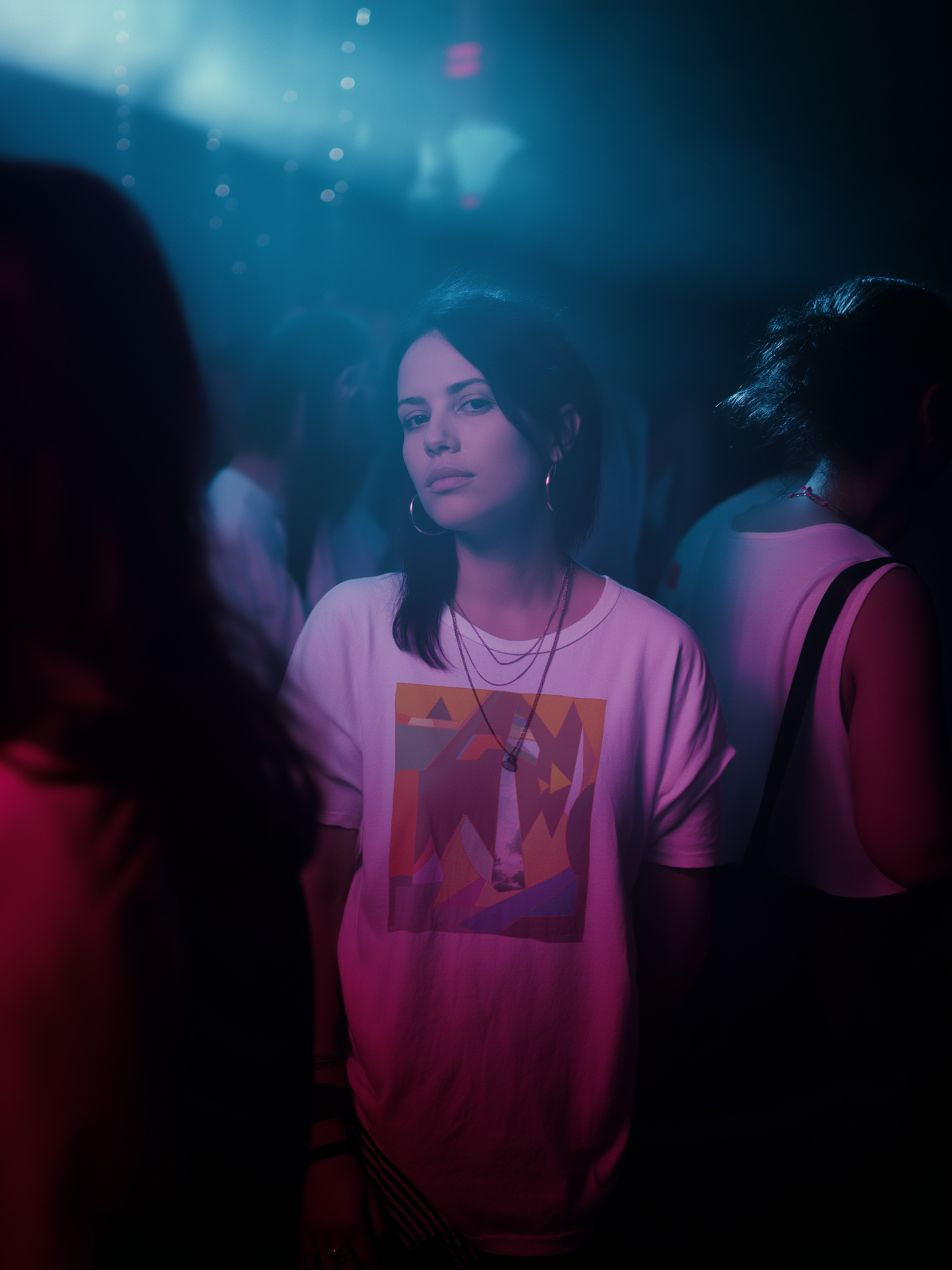 Female wearing a white shirt with abstract colorful geometric design – Wanderluz