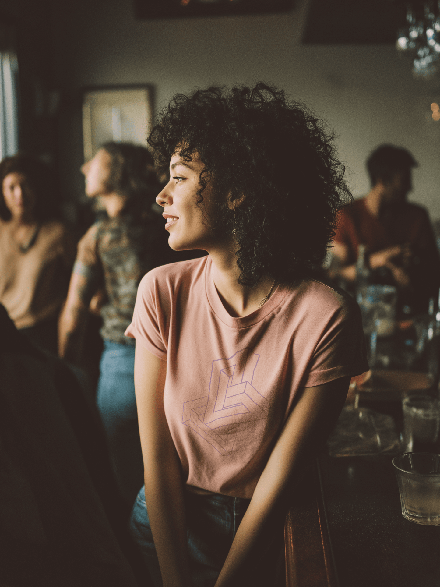 Female at a restaurant wearing organic cotton pink shirt with impossible geometry design in lavender – Wanderluz